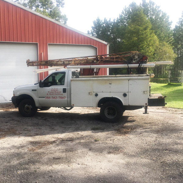 AAA Pump Repair & Well Drilling Truck